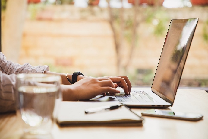 Image of a man using a laptop